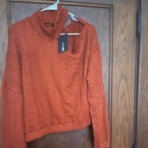 A cut out off the should NWT sweater